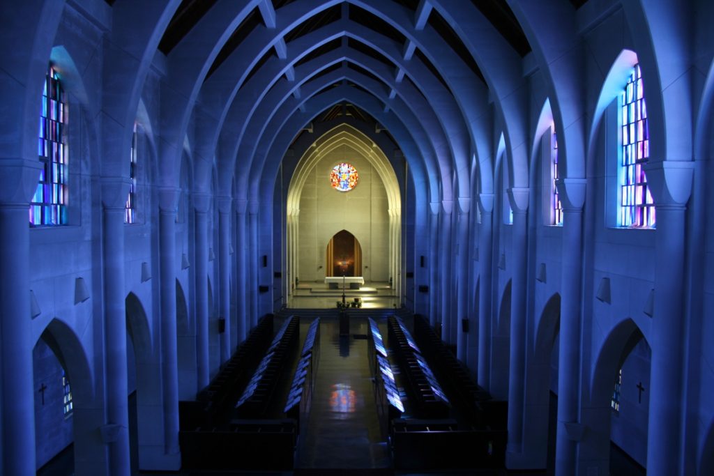 large cathedral with white walls and stained glass